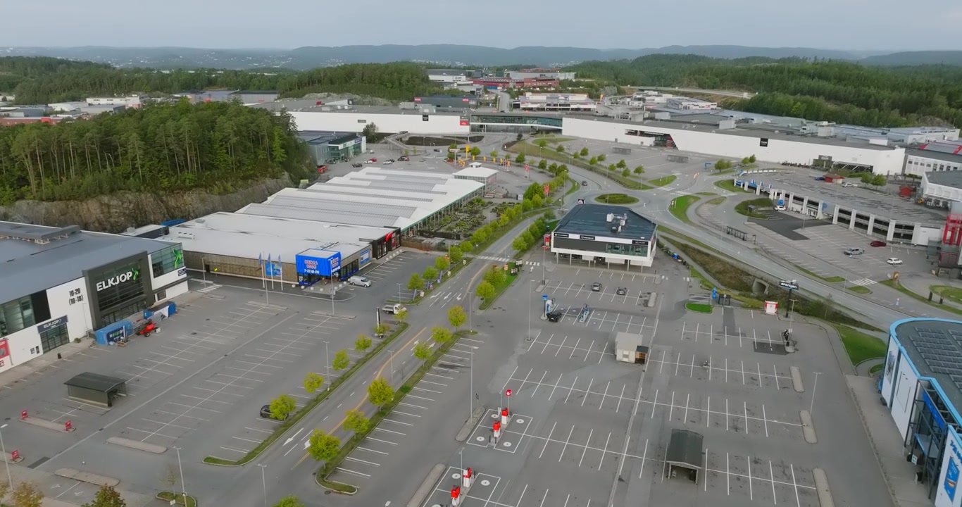 Aerial view of Sørlandsparken commercial district in Kristiansand Norway in slow motion showing public space and day time