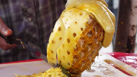 cutting a pineapple