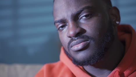 close-up portrait of depressed and unhappy black man.