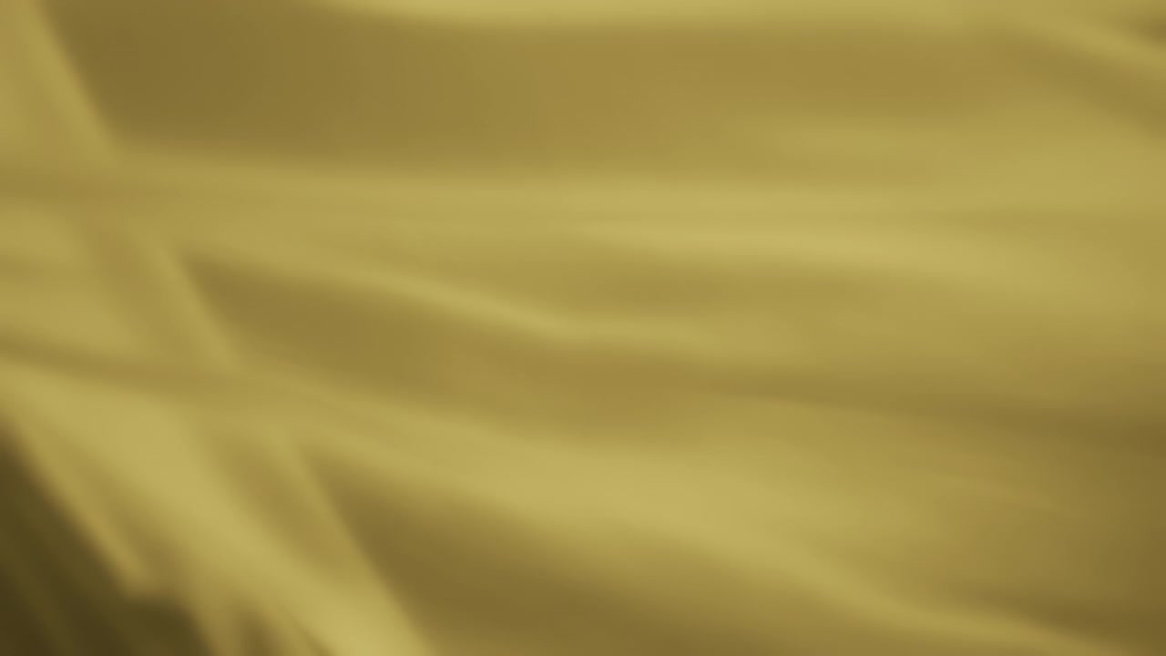 Texture background of yellow chiffon flowing in the wind