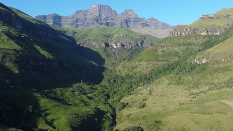 scenic aerial view of the drakensberg mountains with lush vegetation of summer, south africa