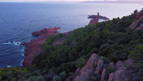 a beautiful aerial landscape of the coast of france and the golden island at sunset