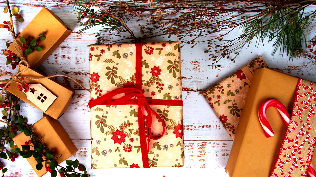 Gift box is lifted to reveal a smartphone with a green screen beneath. Perfect for festive ads, holiday promotions, and creative product displays. Blend of surprise, holiday decor, and tech. Flat lay.