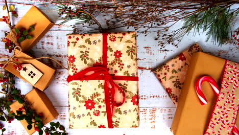 gift box is lifted to reveal a smartphone with a green screen beneath. perfect for festive ads, holiday promotions, and creative product displays. blend of surprise, holiday decor, and tech. flat lay.