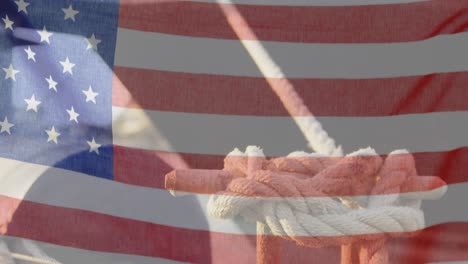 american flag waving against close up view of tied rope