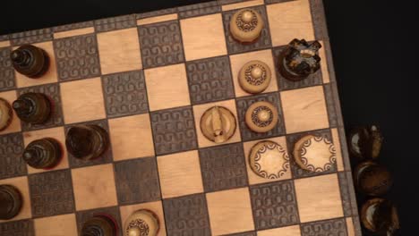 chess matte scene seen from above with knocked puppets