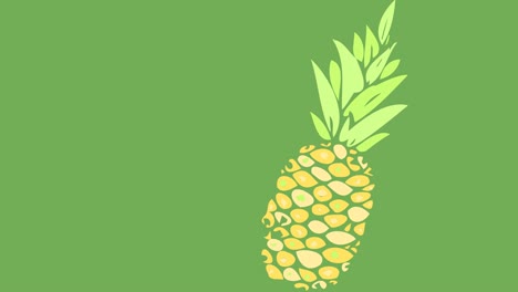 animación de una piña moviéndose sobre un fondo verde