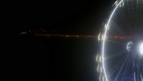 Closeup-of-a-moving-ferris-wheel-by-night