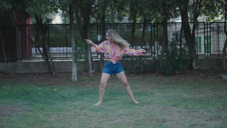 woman dancing in a park