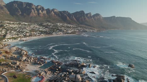 camps bay beach and twelve apostles mountains in cape town, south africa