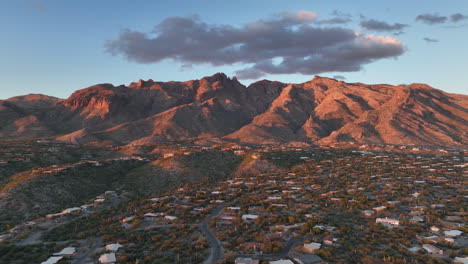 cinematic drone at twilight of tuscon arizona with mountains in the background