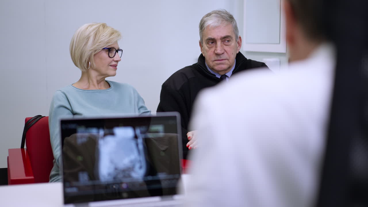 Doctor Consulting with Older Couple