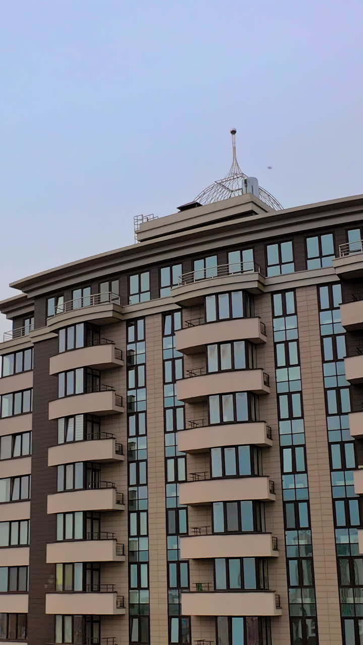 High residential buildings. Tall buildings with rental apartments for residents and commercial property for corporation and companies. Vertical video