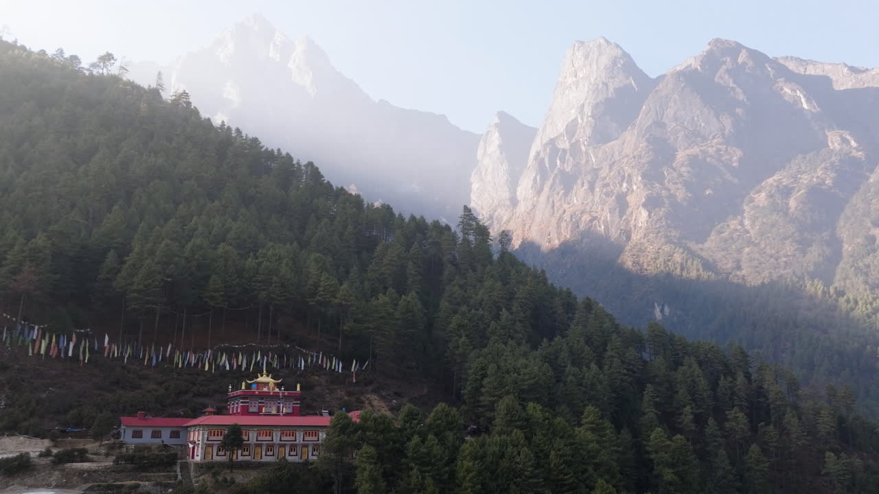 Establishing drone shot of the Phakding Monastery, under peaks of Everest, Nepal