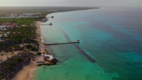 aerial view of dominicus beach at morning, crystal clear sea, beautiful sandy beach and background lighthouse and pier, caribbean sea.bayahibe,dominican republic.motion-lapse