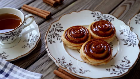 rose shaped cinnamon rolls with tea