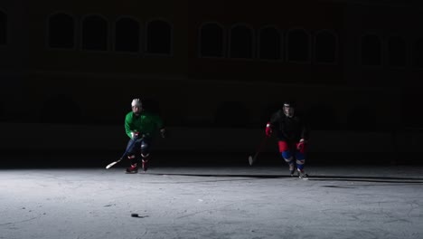 ice hockey players in action at night