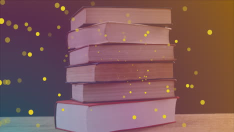 animación de manchas amarillas sobre libros sobre fondo negro