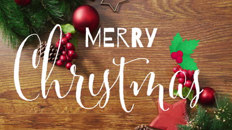 animación de texto de feliz navidad sobre decoraciones festivas en fondo de madera