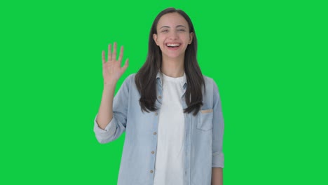 happy indian girl saying hello green screen