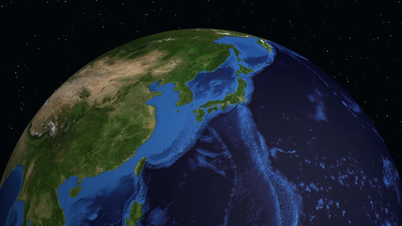 A 3D planet Earth rotates and zooms into Saga, Japan, with a location marker