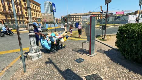 people interacting on a busy naples street