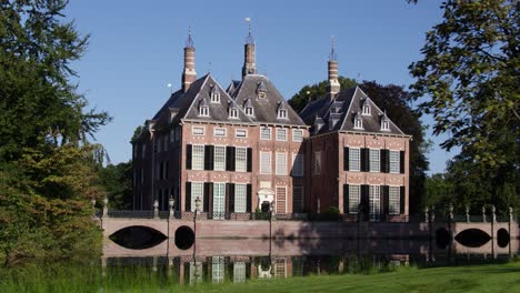 dutch castle with moat and reflection