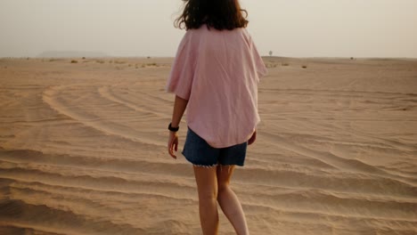woman walking in the desert
