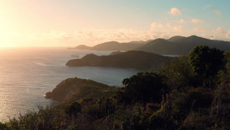 aerial shot of sunset in english harbor in antigua, caribbean with views of yachts, sailboats, marina, bay and cliffs