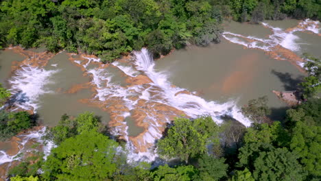 rotating drone shot of the cascadas de agua azul and the waterfalls found on the xanil river in chiapas mexico