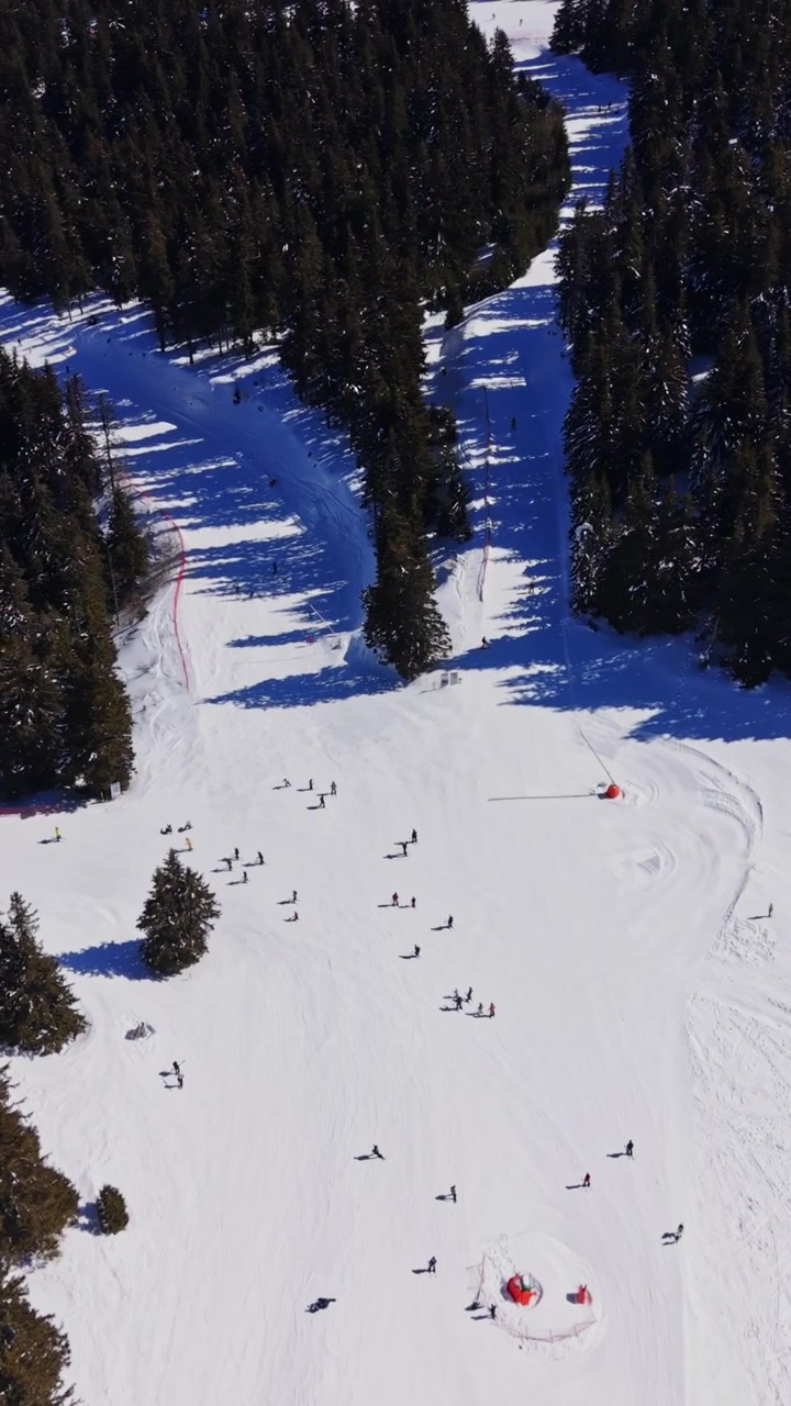 Skiers move through snowy Carpathians in Bulgaria during winter