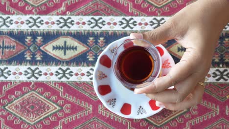 turkish tea in a hand