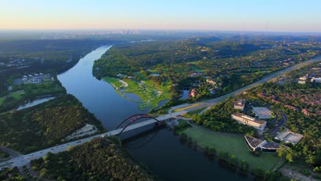 wide aerial drone footage of pennybacker bridge in austin texas