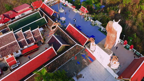 colorful roofs and buddha statue of wat phra that doi kham temple