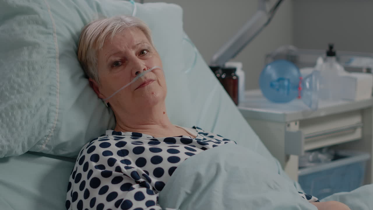 Portrait of senior patient with illness looking at camera