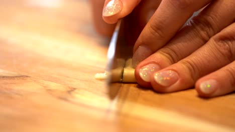 Garlic-being-chopped-on-a-wooden-board-4K