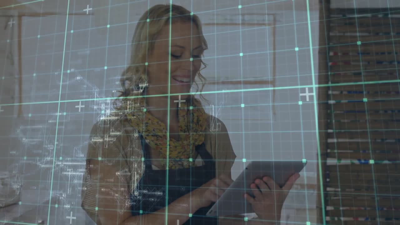 Using tablet, woman viewing digital animation with data grid in background