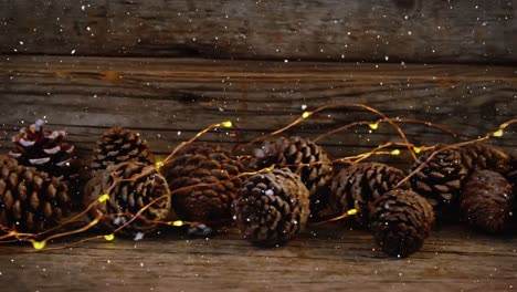 video composition with snow over desk with christmas decoration