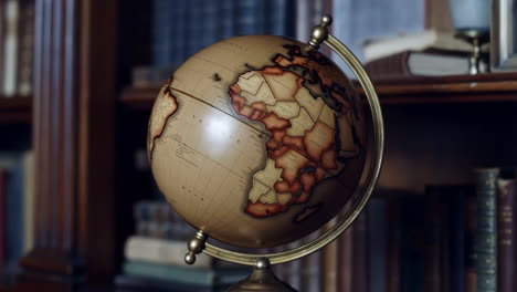 vintage world globe in a study room