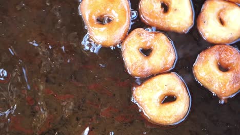 fried doughnuts in hot oil