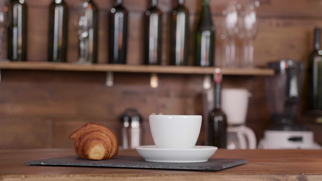 Coffee and Croissant at the Bar
