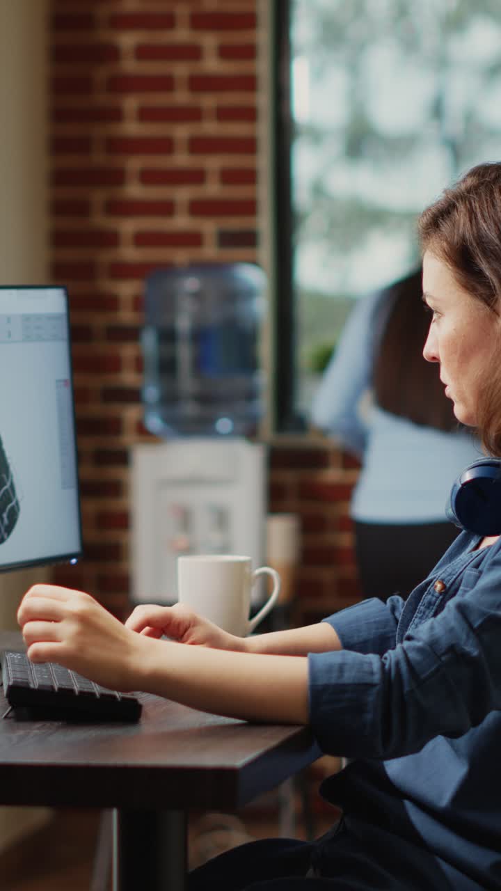 Vertical video: Female engineer working on turbine component development