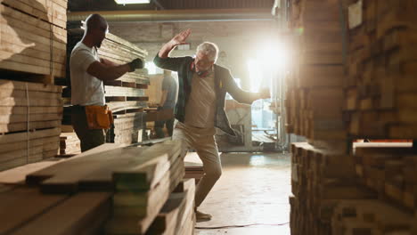 men working with wood in a warehouse