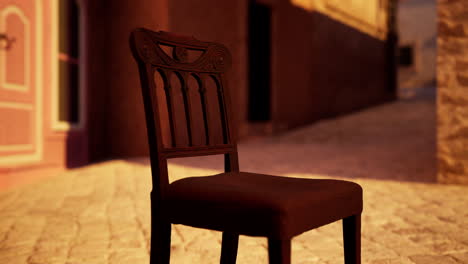 a vintage wooden chair in a narrow back alley