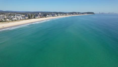 ocean and coastal suburb at palm beach in gold coast, qld, australia - aerial shot