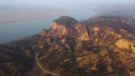 Aerial-drone-shot-of-sand-and-clay-Hills-of-Chambal-River-Valley-with-semi-arid-moor-landscape-in-Beehad-of-Morena-Dholpur-of-Madhya-Pradesh-Rajasthan-of-India