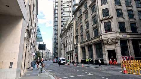 busy street with pedestrians and buildings