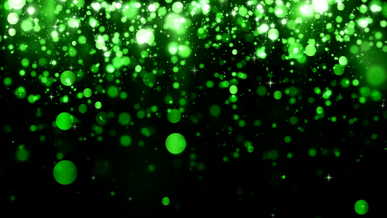 Beautiful glitter light bokeh background. Background with green falling particles. Falling bright confetti and magic light. Seamless loop