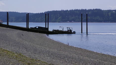 small, nondescript fishing loading onto trailer from public boat launch ramp at camano island state park, wa state 20sec-24fps slow motion