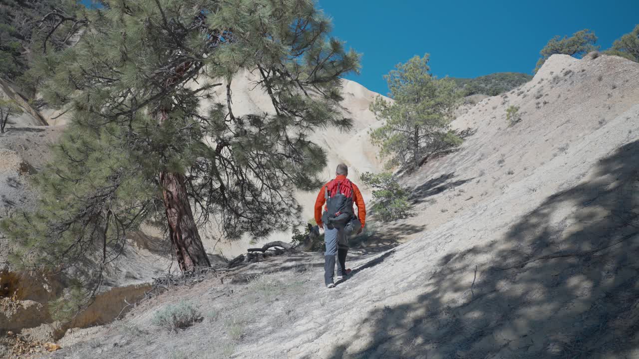 Hiker walking through Sulfur Hills | Big Rock Candy Mountain
